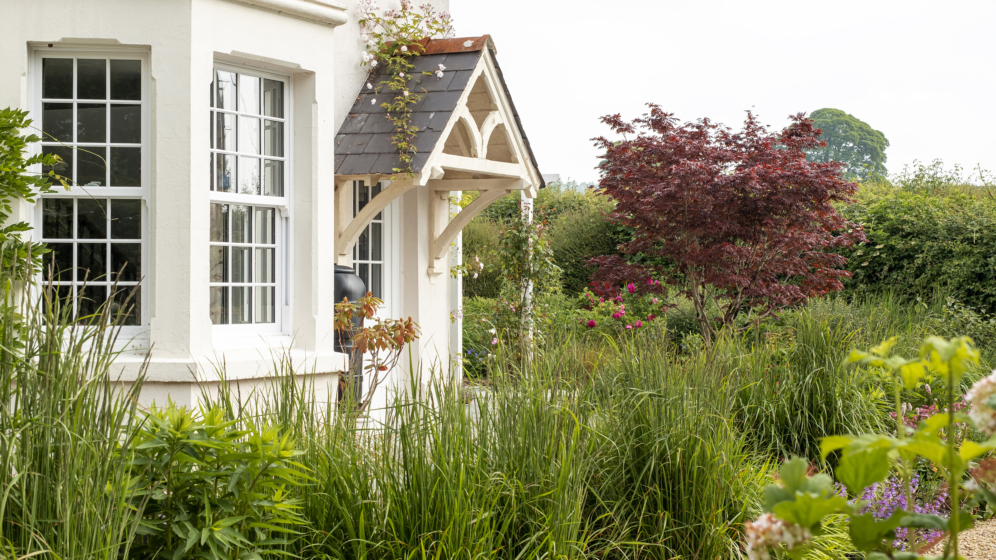 Pristine white rendered house exterior with excellent kerb appeal