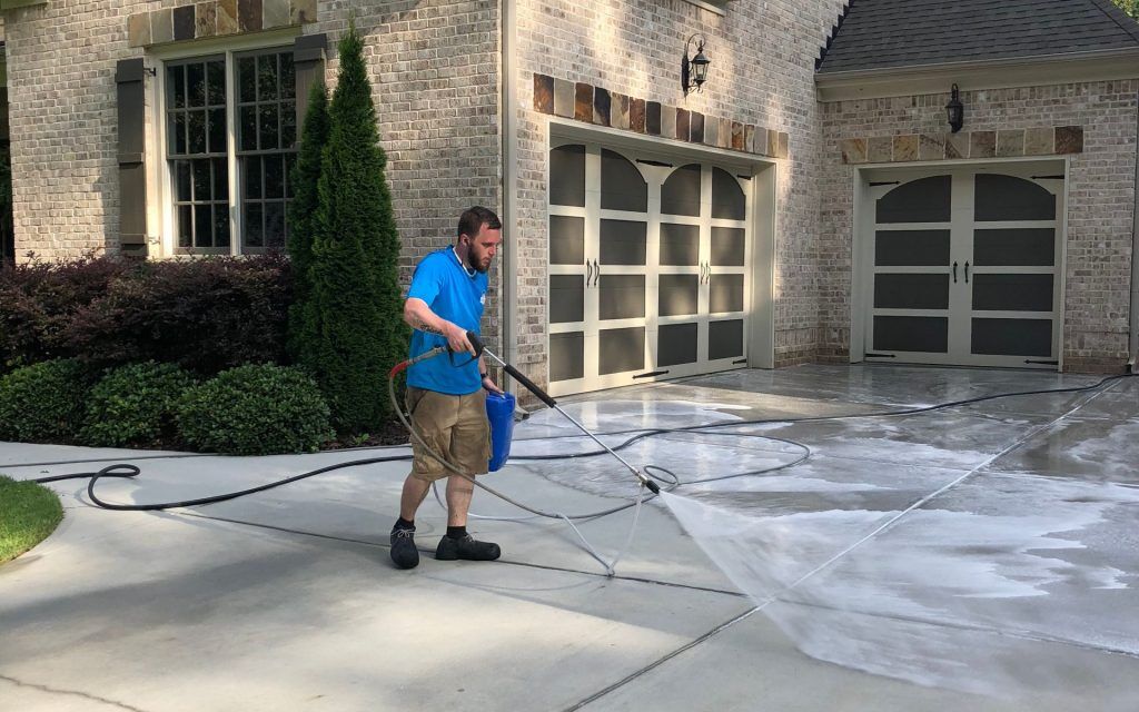 Clean pressure-washed driveway and beautiful home exterior